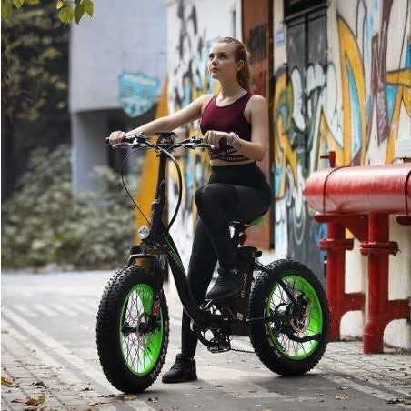 Green AddMotor Motan M140 - Folding Fat Tire Electric Bike - Riding in Street