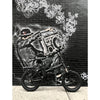 Image of Joulvert Playa Desert - Folding Electric Bike - parked in front of graffiti