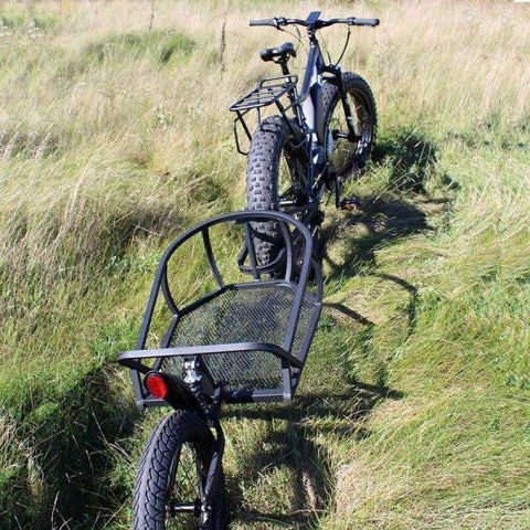Rambo Bikes - Single Wheeled Cart - Attached to E-Bike in a field 