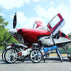 Image of Enzo eBikes - Folding Electric Bike - Multiple in front of airplane