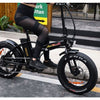 Image of Black AddMotor Motan M150 - Folding Fat Tire Electric Bike - Riding Down Street