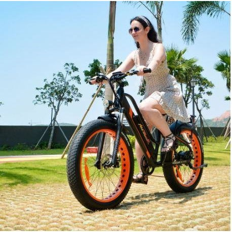 Orange AddMotor Motan M450 - Fat Tire Electric Bike - Female Rider on Bricks