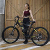 Image of Yellow AddMotor HitHot H1 - Electric Mountain Bike - in front of barn door