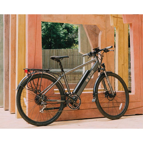 Grey e-Joe KODA Sports Class - Electric Commuter Bike - Leaning against wood panels 
